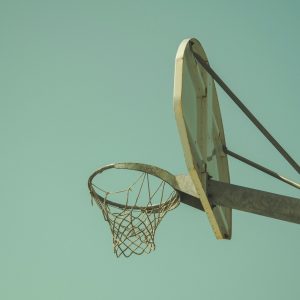 low angled photography of beige basketball hoop